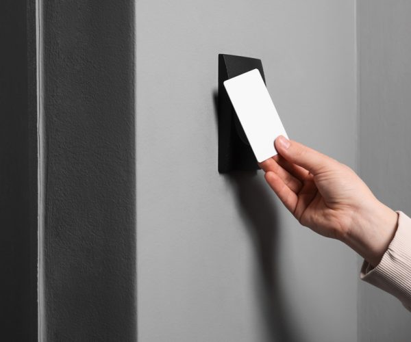 Woman,Opening,Magnetic,Door,Lock,With,Key,Card,,Closeup.,Home